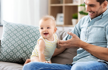 Image showing father with little baby daughter at home