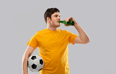 Image showing man or football fan with soccer ball drinking beer