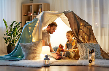 Image showing happy family playing with toy in kids tent at home