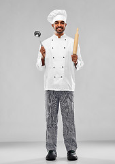 Image showing happy indian chef with ladle and rolling-pin