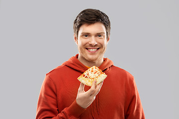 Image showing happy young man eating pizza