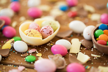 Image showing chocolate easter eggs and candy drops on table