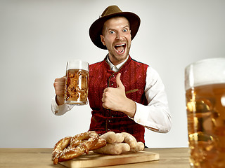 Image showing Germany, Bavaria, Upper Bavaria, man with beer dressed in traditional Austrian or Bavarian costume