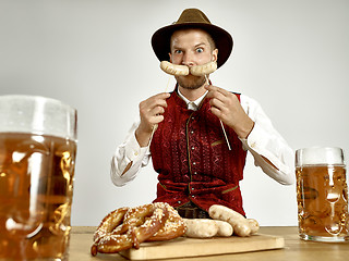 Image showing Germany, Bavaria, Upper Bavaria, man with beer dressed in traditional Austrian or Bavarian costume