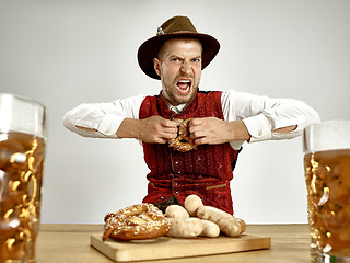 Image showing Germany, Bavaria, Upper Bavaria, man with beer dressed in traditional Austrian or Bavarian costume