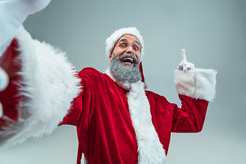 Image showing Funny guy in christmas hat. New Year Holiday. Christmas, x-mas, winter, gifts concept.