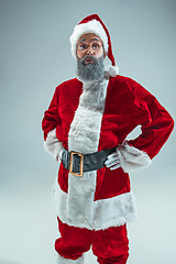 Image showing Funny guy in christmas hat. New Year Holiday. Christmas, x-mas, winter, gifts concept.