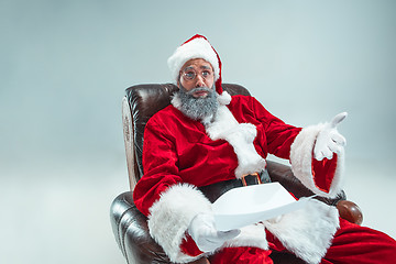 Image showing Funny guy in christmas hat. New Year Holiday. Christmas, x-mas, winter, gifts concept.