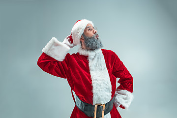 Image showing Funny guy in christmas hat. New Year Holiday. Christmas, x-mas, winter, gifts concept.