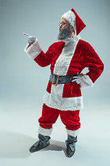 Image showing Funny guy in christmas hat. New Year Holiday. Christmas, x-mas, winter, gifts concept.