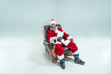 Image showing Funny guy in christmas hat. New Year Holiday. Christmas, x-mas, winter, gifts concept.