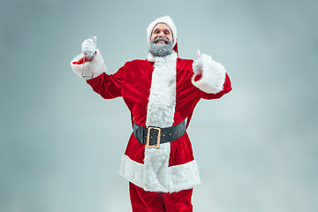 Image showing Funny guy in christmas hat. New Year Holiday. Christmas, x-mas, winter, gifts concept.