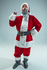 Image showing Funny guy in christmas hat. New Year Holiday. Christmas, x-mas, winter, gifts concept.