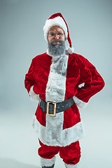 Image showing Funny guy in christmas hat. New Year Holiday. Christmas, x-mas, winter, gifts concept.