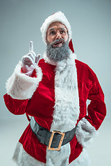 Image showing Funny guy in christmas hat. New Year Holiday. Christmas, x-mas, winter, gifts concept.