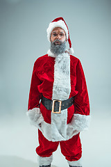 Image showing Funny guy in christmas hat. New Year Holiday. Christmas, x-mas, winter, gifts concept.