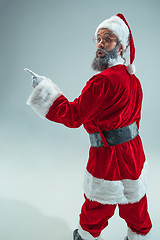 Image showing Funny guy in christmas hat. New Year Holiday. Christmas, x-mas, winter, gifts concept.