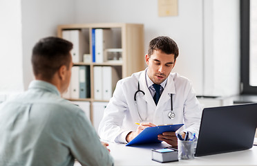 Image showing doctor with clipboard and male patient at hospital