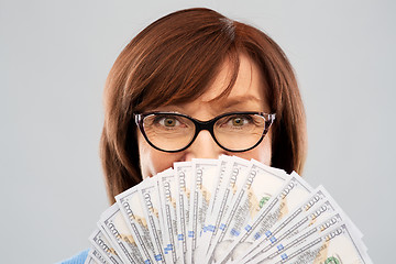 Image showing senior woman with hundred dollar money banknotes