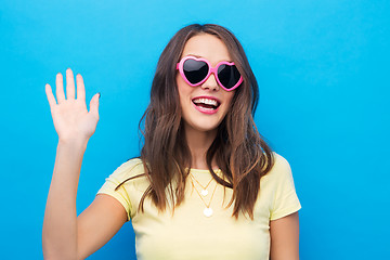 Image showing teenage girl in heart-shaped sunglasses