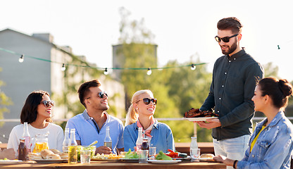 Image showing friends at bbq party on rooftop in summer