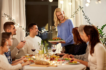 Image showing happy family having dinner party at home