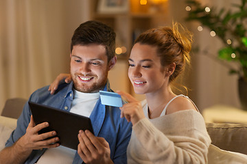 Image showing couple with tablet pc and credit card at home