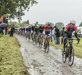 Image showing The Peloton on a Cobblestone Road - Tour de France 2014