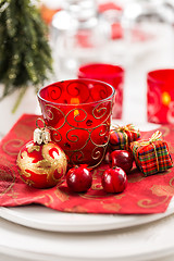 Image showing Christmas And New Year Holiday Table Setting.  Place setting for Christmas Dinner. Holiday Decorations. 