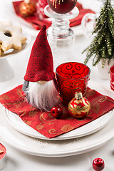 Image showing Christmas And New Year Holiday Table Setting.  Place setting for Christmas Dinner. Holiday Decorations. 