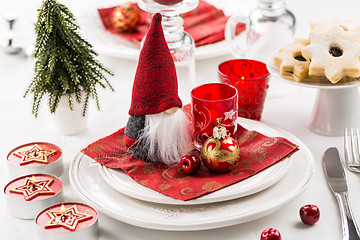 Image showing Christmas And New Year Holiday Table Setting.  Place setting for Christmas Dinner. Holiday Decorations. 