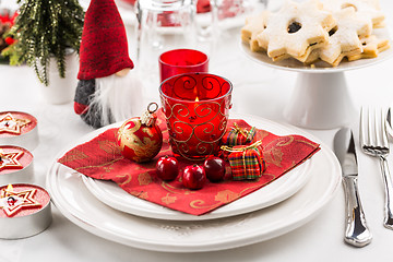 Image showing Christmas And New Year Holiday Table Setting.  Place setting for Christmas Dinner. Holiday Decorations. 