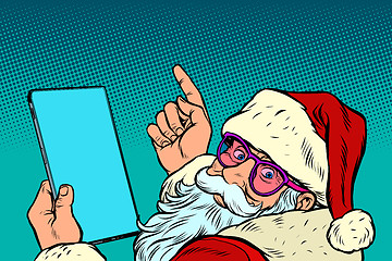 Image showing Santa Claus with a tablet. New year and Christmas online sales concept