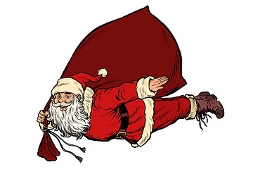 Image showing Santa Claus superhero is flying with a bag of gifts