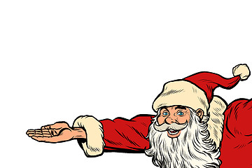 Image showing Santa Claus hand presents. Christmas and New year