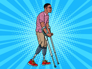 Image showing legless african veteran with a bionic prosthesis with crutches. a disabled man learns to walk after an injury. rehabilitation treatment and recovery