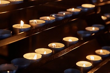 Image showing Candles in a dark church