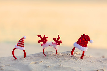 Image showing Christmas Santa Hat headbands on beach