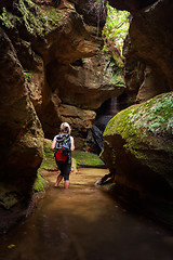 Image showing Tourist or female adventurer exploring a canyon 