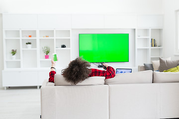 Image showing young man in bathrobe enjoying free time