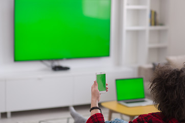 Image showing young man in bathrobe enjoying free time