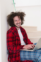 Image showing freelancer in bathrobe working from home