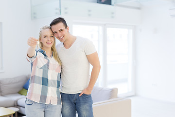Image showing couple showing a keys of their new house