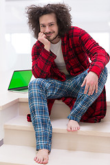 Image showing freelancer in bathrobe working from home