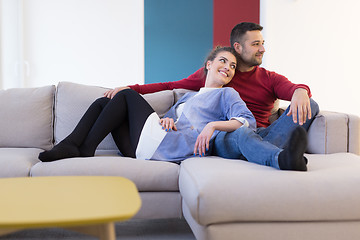 Image showing couple hugging and relaxing on sofa