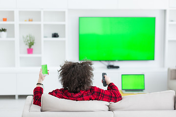 Image showing young man in bathrobe enjoying free time