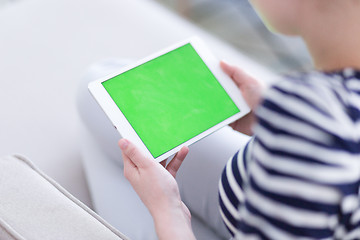 Image showing woman on sofa using tablet computer