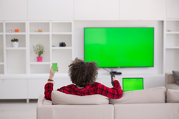 Image showing young man in bathrobe enjoying free time