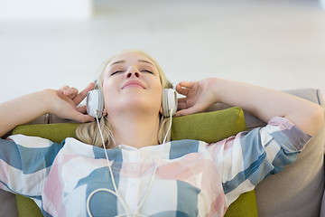 Image showing girl enjoying music through headphones