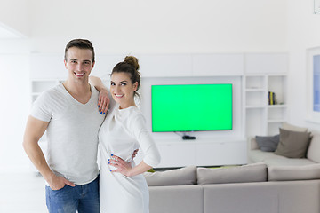 Image showing couple hugging in their new home